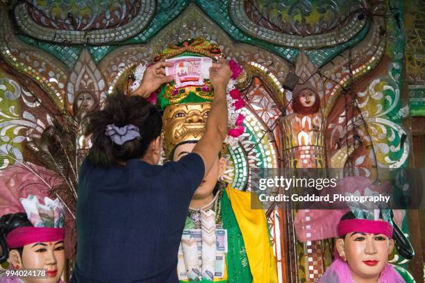 myanmar: mother spirit of popa nat shrine - myanmar flower stock pictures, royalty-free photos & images