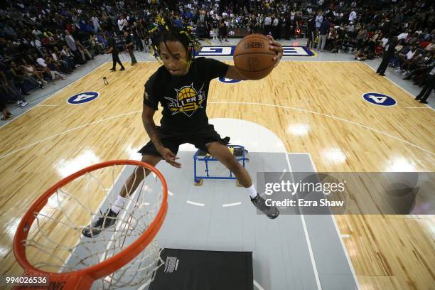 Performer dunks the ball during an intermission in week three of the BIG3 three on three basketball league game at ORACLE Arena on July 6, 2018 in...