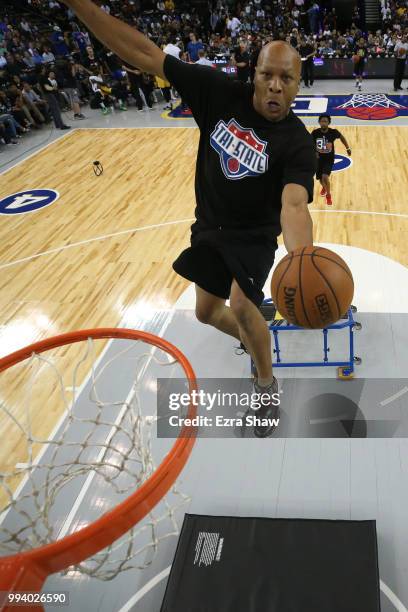 Performer dunks the ball during an intermission in week three of the BIG3 three on three basketball league game at ORACLE Arena on July 6, 2018 in...