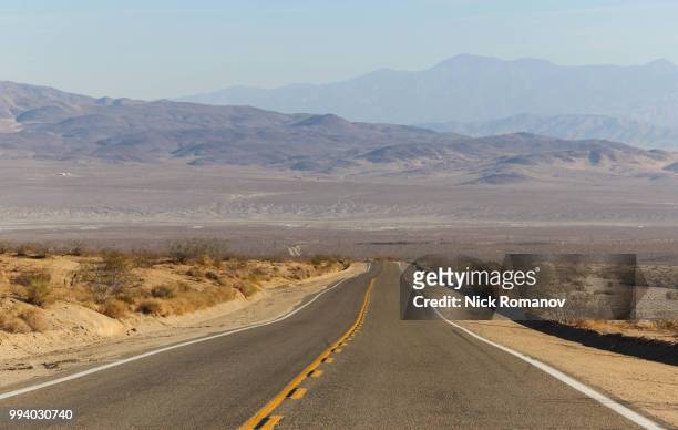 road in death valley - romanov stock pictures, royalty-free photos & images