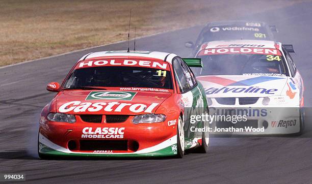 Larry Perkins in the Perkins Motorsport Holden Commodore VX leads the field during the Queensland 500 V8 Supercar practice, held at the Queensland...