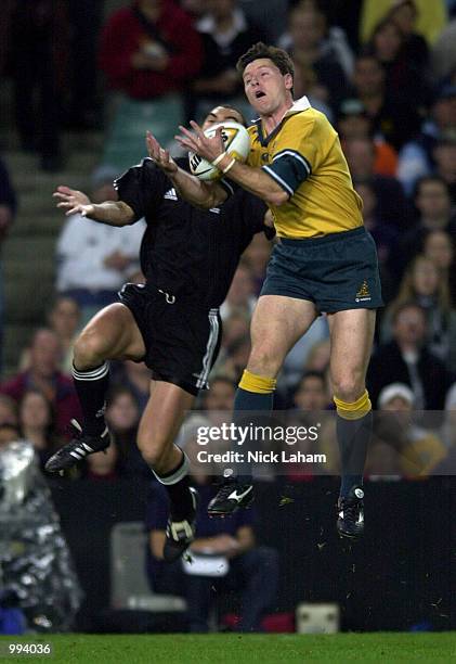 Matt Burke of the Wallabies and Roger Randle of the Maori's contest the ball during the rugby union match between the Australian Wallabies and the...