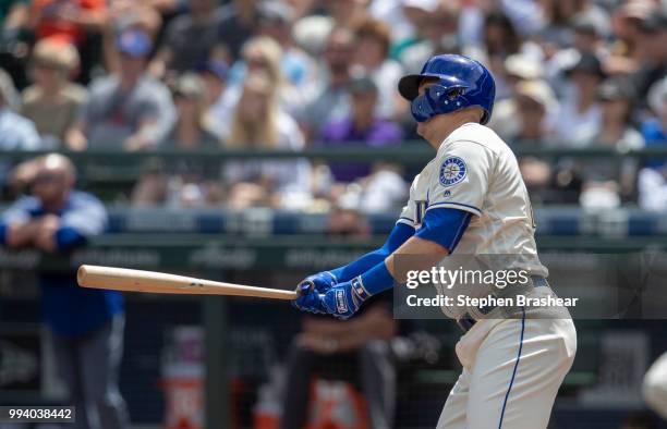 Ryon Healy of the Seattle Mariners hits a two-run double off of starting pitcher Antonio Senzatela of the Colorado Rockies that also scored Mitch...