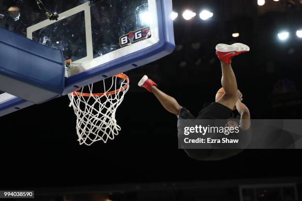 Performer dunks the ball during an intermission in week three of the BIG3 three on three basketball league game at ORACLE Arena on July 6, 2018 in...