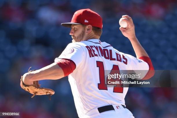 Mark Reynolds of the Washington Nationals pitches in the ninth inning during a baseball game against the Miami Marlins at Nationals Park on July 8,...