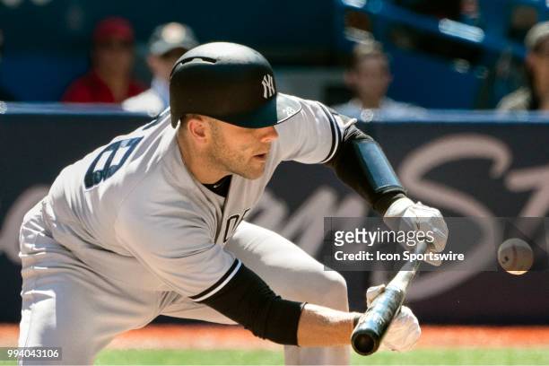 New York Yankees Catcher Austin Romine bunts advancing the runner to second during the MLB game between the New York Yankees and the Toronto Blue...