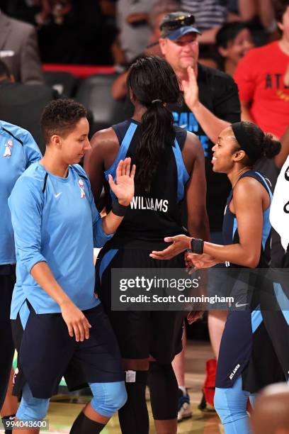 Layshia Clarendon high-fives Renee Montgomery of the Atlanta Dream after the win against the Phoenix Mercury on July 8, 2018 at McCamish Pavilion in...