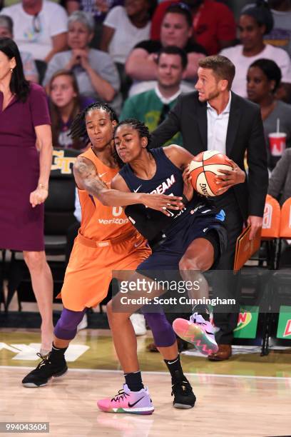 Tiffany Hayes of the Atlanta Dream handles the ball against Angel Robinson of the Phoenix Mercury on July 8, 2018 at McCamish Pavilion in Atlanta,...