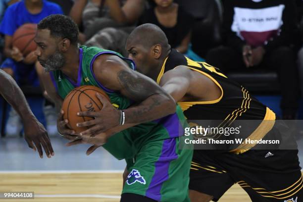 Qyntel Woods of 3 Headed Monsters drives with the ball against Metta World Peace of Killer 3s during week three of the BIG3 three on three basketball...