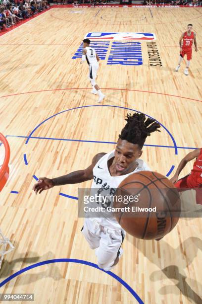 Lonnie Walker IV of the San Antonio Spurs grabs the rebound against the Washington Wizards during the 2018 Las Vegas Summer League on July 8, 2018 at...