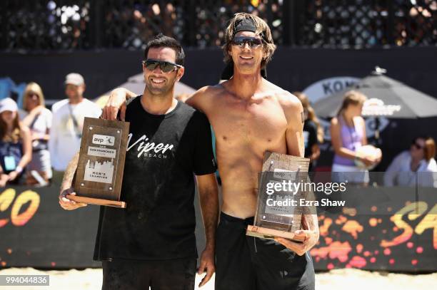 Roberto Rodriguez and Ed Ratledge hold up their plaques after beating Chase Budinger and Sean Rosenthal to win the Men's AVP San Francisco Open at...