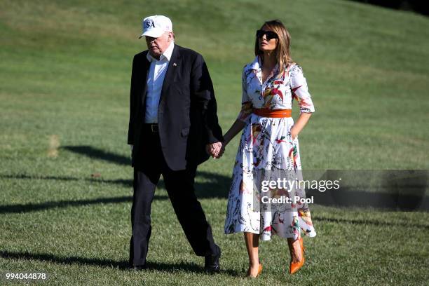 President Donald Trump and first lady Melania Trump cross the South Lawn upon arrival at the White House on July 8, 2018 in Washington, DC. The First...