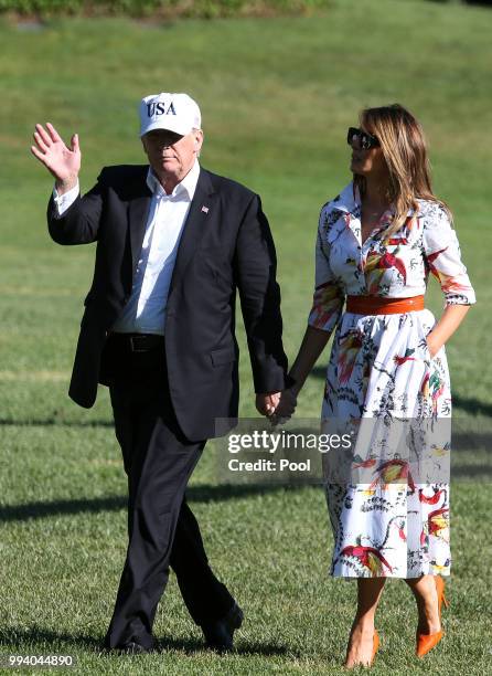 President Donald Trump and first lady Melania Trump cross the South Lawn upon arrival at the White House on July 8, 2018 in Washington, DC. The First...