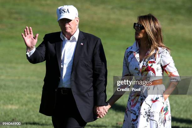 President Donald Trump and first lady Melania Trump cross the South Lawn upon arrival at the White House on July 8, 2018 in Washington, DC. The First...
