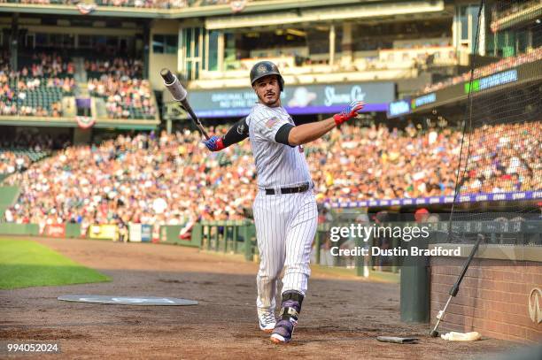 Nolan Arenado of the Colorado Rockies takes a swing in the on deck circle before batting against the San Francisco Giants in the first inning of a...