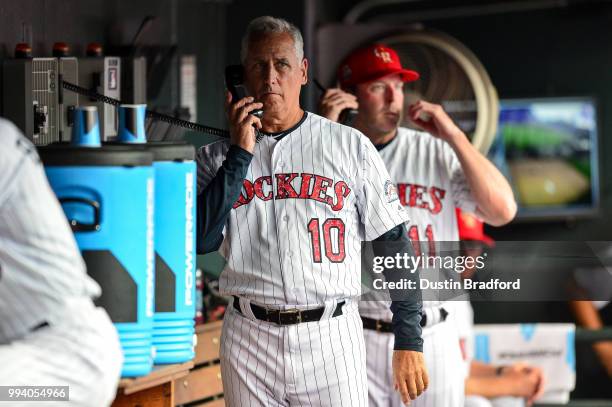 Bud Black of the Colorado Rockies talks on the dugout bullpen phone during a game against the San Francisco Giants at Coors Field on July 4, 2018 in...