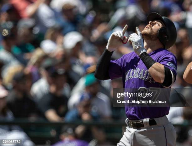 Trevor Story of the Colorado Rockies celebrates after hitting a two-run home run off of starting pitcher Wade LeBlanc of the Seattle Mariners that...