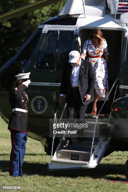 President Donald Trump and first lady Melania Trump step off Marine One on the South Lawn upon arrival at the White House on July 8, 2018 in...