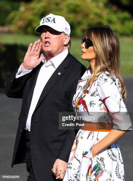 President Donald Trump and first lady Melania Trump cross the South Lawn upon arrival at the White House on July 8, 2018 in Washington, DC. The First...