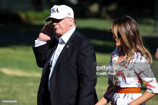 President Donald Trump and first lady Melania Trump cross the South Lawn upon arrival at the White House on July 8, 2018 in Washington, DC. The First...