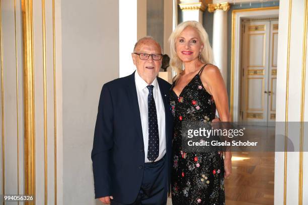 Joseph Vilsmaier and his girlfriend Birgit Muth during the 'Oper fuer alle - Parsifal' as part of the Munich Opera Festival at Nationaltheater on...