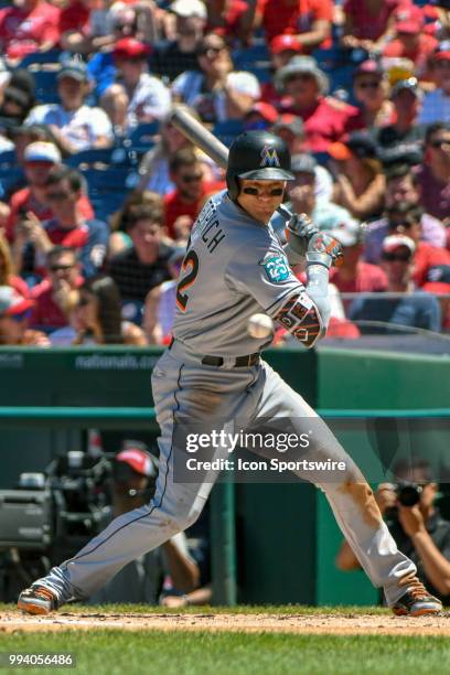 Miami Marlins left fielder Derek Dietrich is hit by a pitch in the first inning during the game between the Miami Marlins and the Washington...