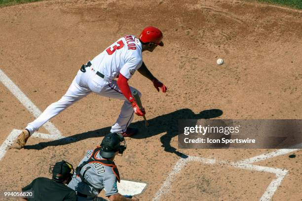 Washington Nationals center fielder Michael Taylor attempts to bunt for a hit in the fifth inning during the game between the Miami Marlins and the...