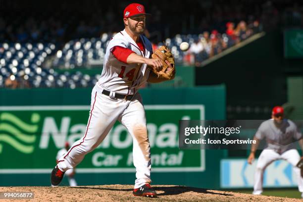 Washington Nationals third baseman Mark Reynolds pitches in the ninth inning during the game between the Miami Marlins and the Washington Nationals...