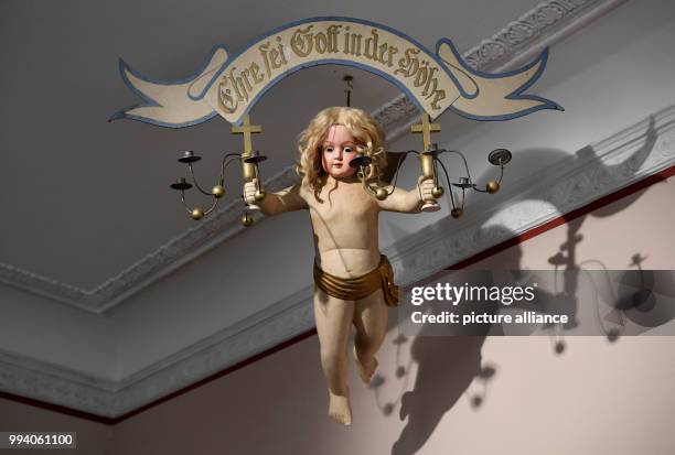 An angel as a lamp can be seen in a room of the Christmas museum in Husum, Germany, 17 August 2017. The Husum Christmas House and its historic shop...