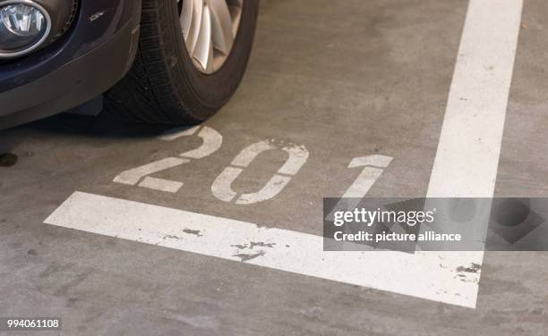 Numbered parking space in a multi-storey car park in Muenster, Germany, 8 September 2017. The width of parking spaces is to be increased in many car...