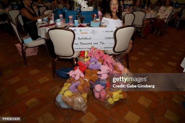 Collection of teddy bears and a check for USD 5,000 is collected during Coach Woodson Invitational presented by MGM Resorts International, a PGD...