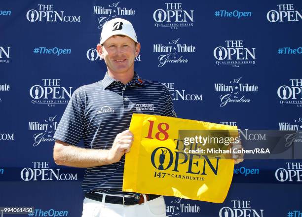 Brandt Snedeker of the United States holds a hole flag after qualifying for the Open Championship during the fourth and final round of A Military...