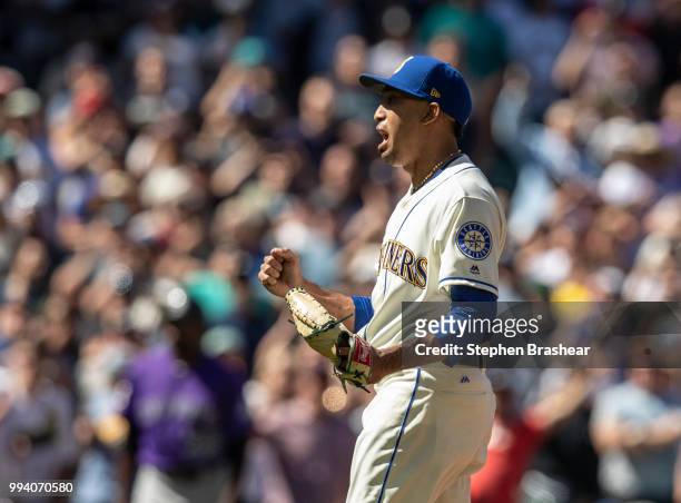 Relief pitcher Edwin Diaz of the Seattle Mariners reacts after striking out the side to end a game against the Colorado Rockies at Safeco Field on...