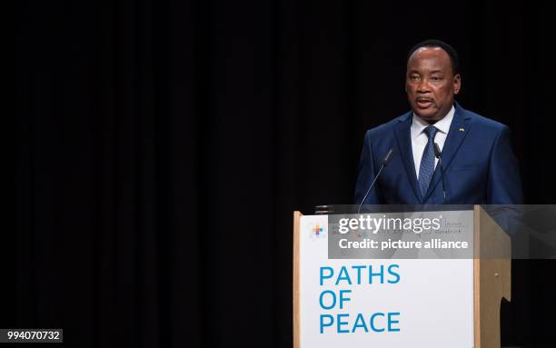 Mahamadou Issoufou, President of Niger speaks at the "Paths of Peace" 2017 opening in Muensterland hall in Muenster, Germany, 10 September 2017....