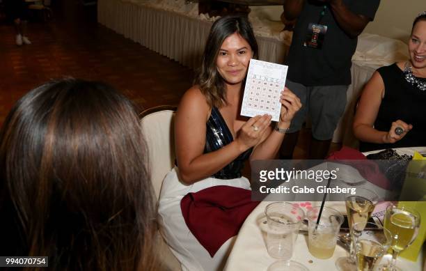 Guest shows off her winning bingo card during Coach Woodson Invitational presented by MGM Resorts International, a PGD Global production, at Cascata...