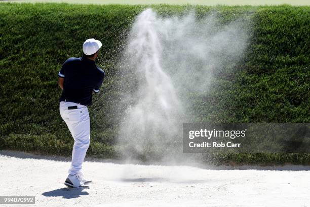 Harold Varner III hits from the bunker to the 12th green during the final round of A Military Tribute At The Greenbrier held at the Old White TPC...