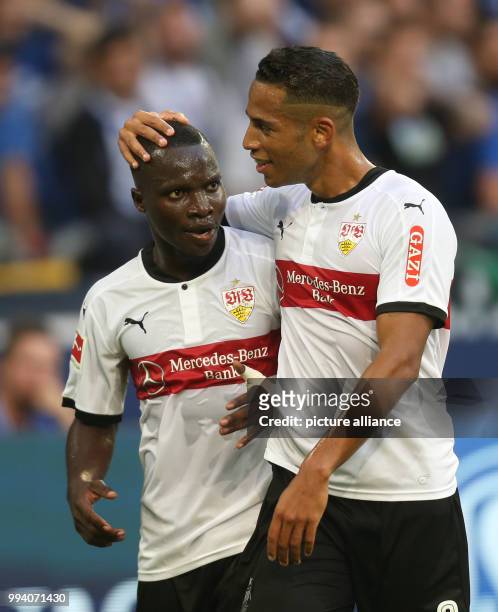 Stuttgart's Chadrac Akolo and Dennis Aogo celebrate the equaliser-goal during the German Bundesliga soccer match between Schalke 04 and VfB Stuttgart...
