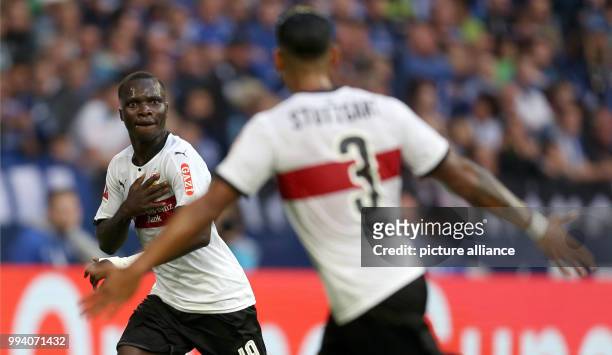 Stuttgart's Chadrac Akolo and Dennis Aogo celebrate the equaliser-goal during the German Bundesliga soccer match between Schalke 04 and VfB Stuttgart...