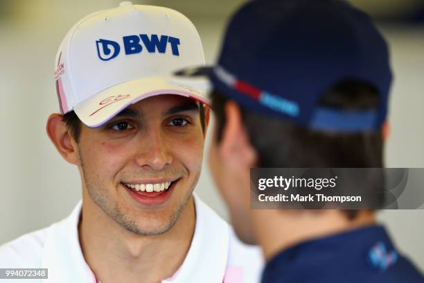 Esteban Ocon of France and Force India talks with Lance Stroll of Canada and Williams before the Formula One Grand Prix of Great Britain at...