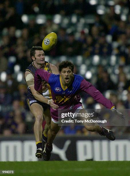 Joshua Wooden for the West Coast Eagles tackles Darryl White for the Brisbane Lions , in the match between the West Coast Eagles and the Brisbane...