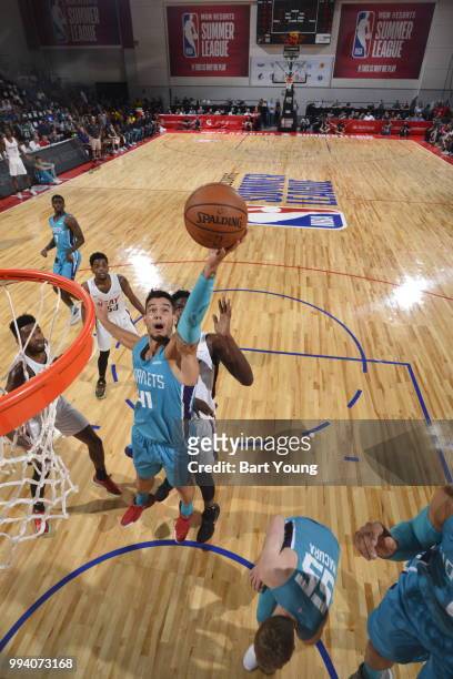 Willy Hernangomez of the Charlotte Hornets drives to the basket during the game against the Miami Heat on July 8, 2018 at the Cox Pavilion in Las...