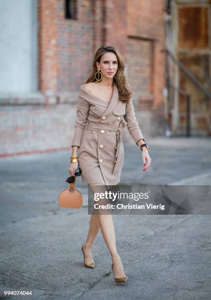 Alexandra Lapp wearing Jordyn Blazer Dress in mocha by Misha Collection, bag Numero Six in camel by Polene Paris, Iriza Glitter heels in gold by...