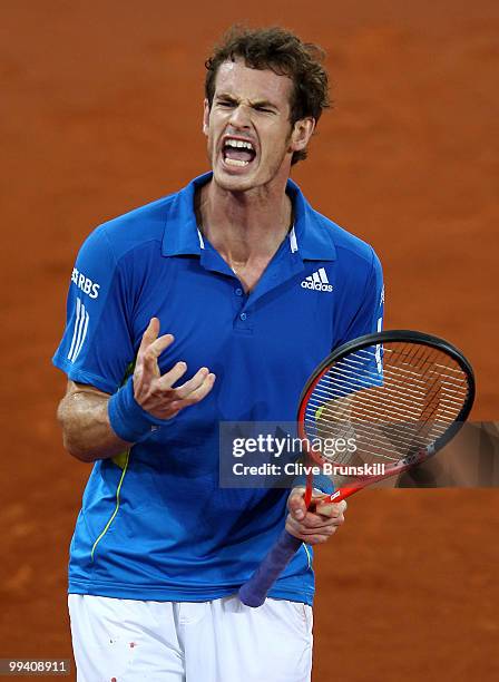 Andy Murray of Great Britain screams with frustration after losing the first set against David Ferrer of Spain in their quarter final match during...