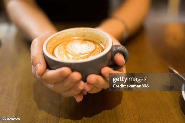 asian female feel relax and drink coffee - coffee drink stock pictures, royalty-free photos & images