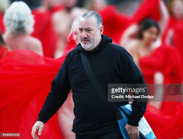 Spencer Tunick instructs participants to pose as part of Spencer Tunick's nude art installation Return of the Nude on July 9, 2018 in Melbourne,...