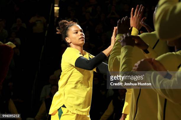 Alysha Clark of the Seattle Storm high-fives teammates as she is introduced before the game against the Washington Mystics on July 8, 2018 at Key...