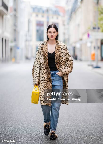 Maria Barteczko wearing leopard print coat Valentino, black Villalo cashmere top, used Monki boyfriend jeans, black fur slipper Gucci, yellow...