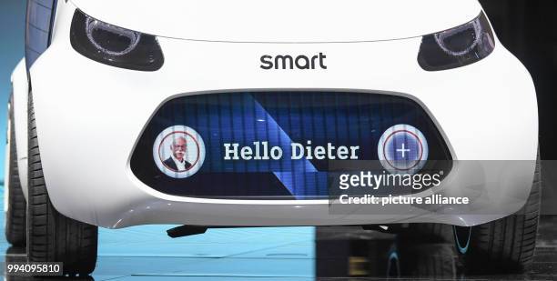 The display of a Smart vision EQ fortwo shows the words "Hello Dieter" and a foto of Mercedes-Benz CEO Dieter Zetsche during the "Mercedes-Benz Media...
