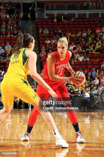 Elena Delle Donne of the Washington Mystics handles the ball against Breanna Stewart of the Seattle Storm on July 8, 2018 at Key Arena in Seattle,...