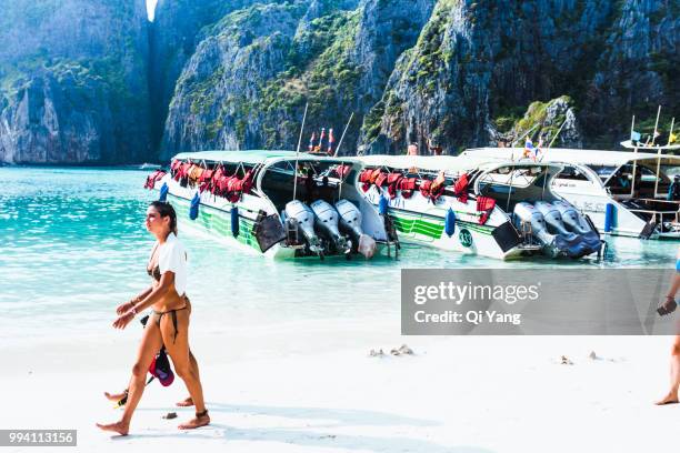 woman walking on the beach, thailand - qi yang stock pictures, royalty-free photos & images